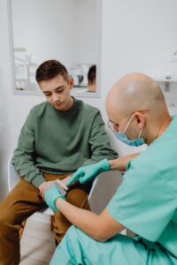 Teenager talking to dentist at family dental care clinic